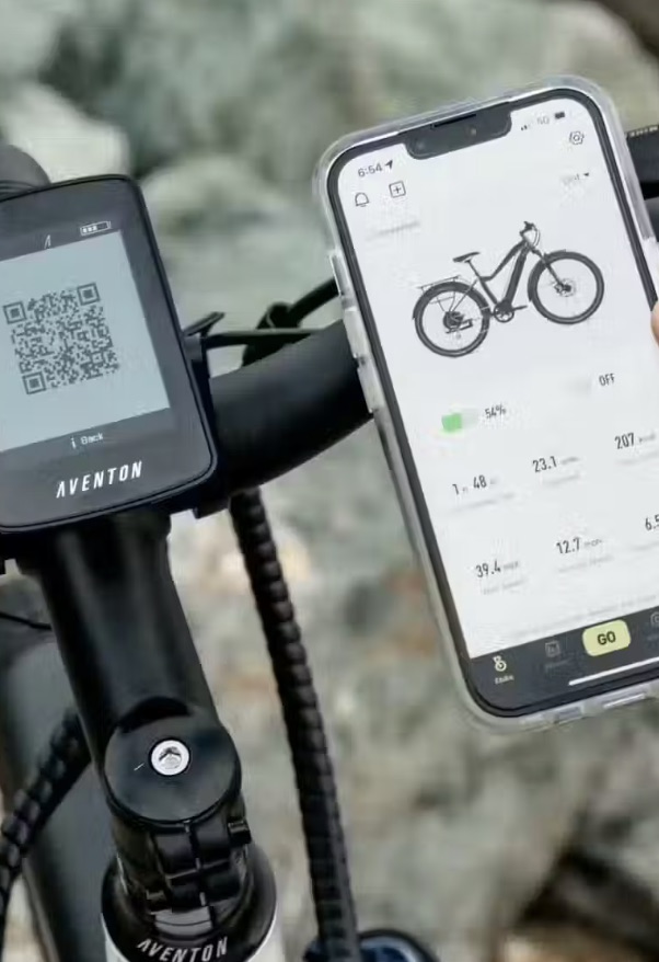 A close up of the app and handlebars on an Aventon ebike