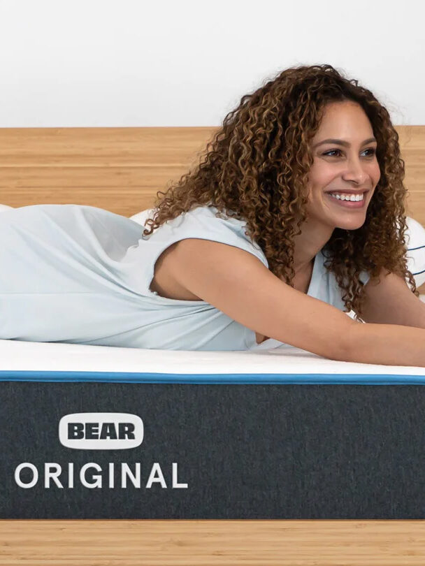 A model lounging on a Bear mattress