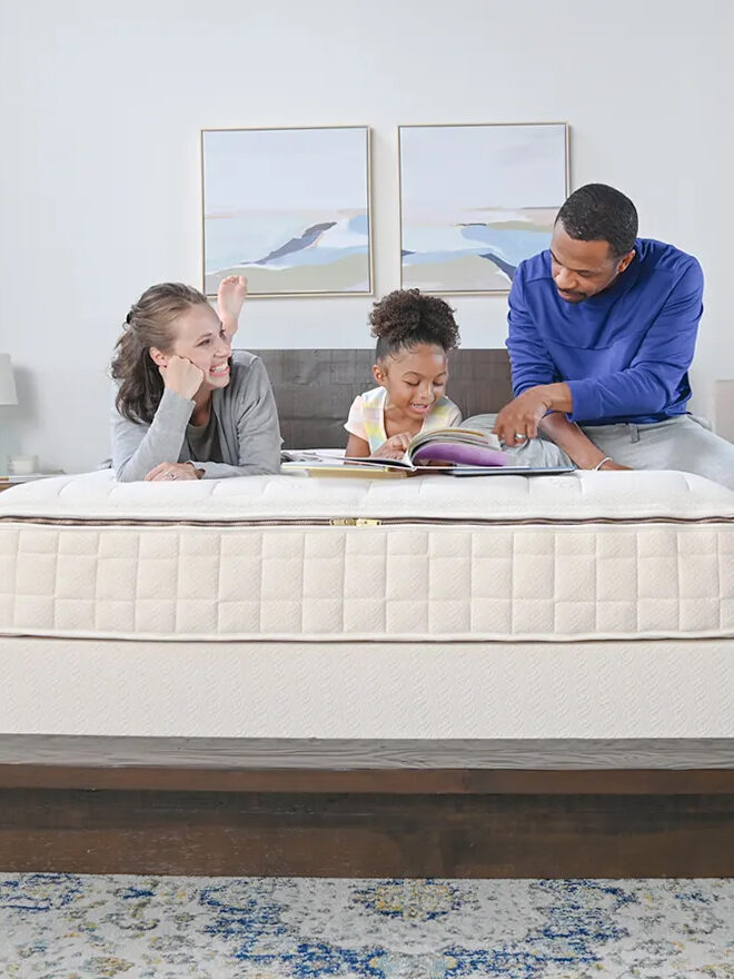 A family on a Naturepedic mattress