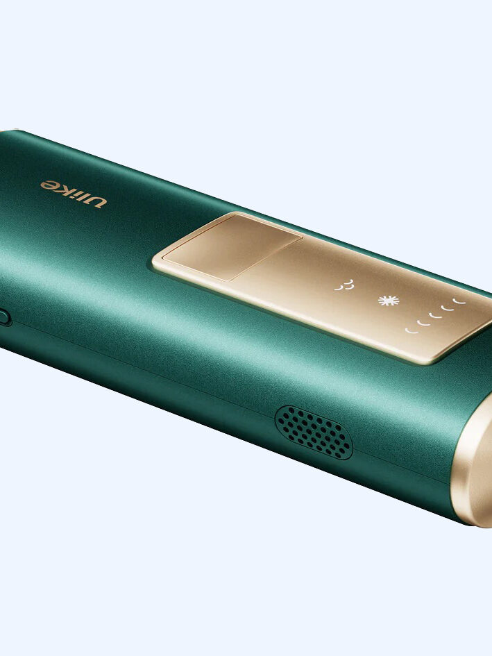 A green and gold hair removal device from Ulike with a price tag on it.