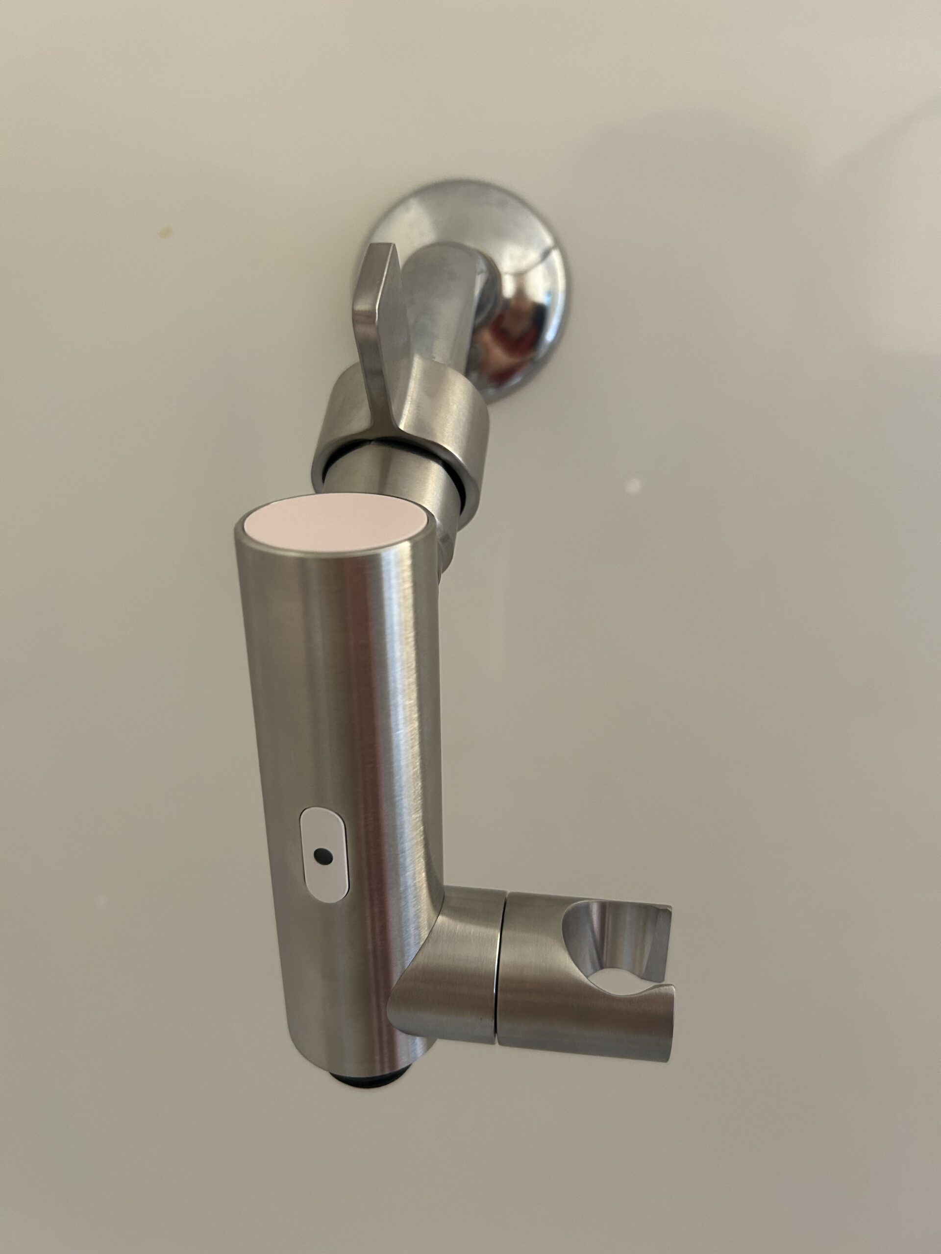 A stainless steel faucet with a handle on it.