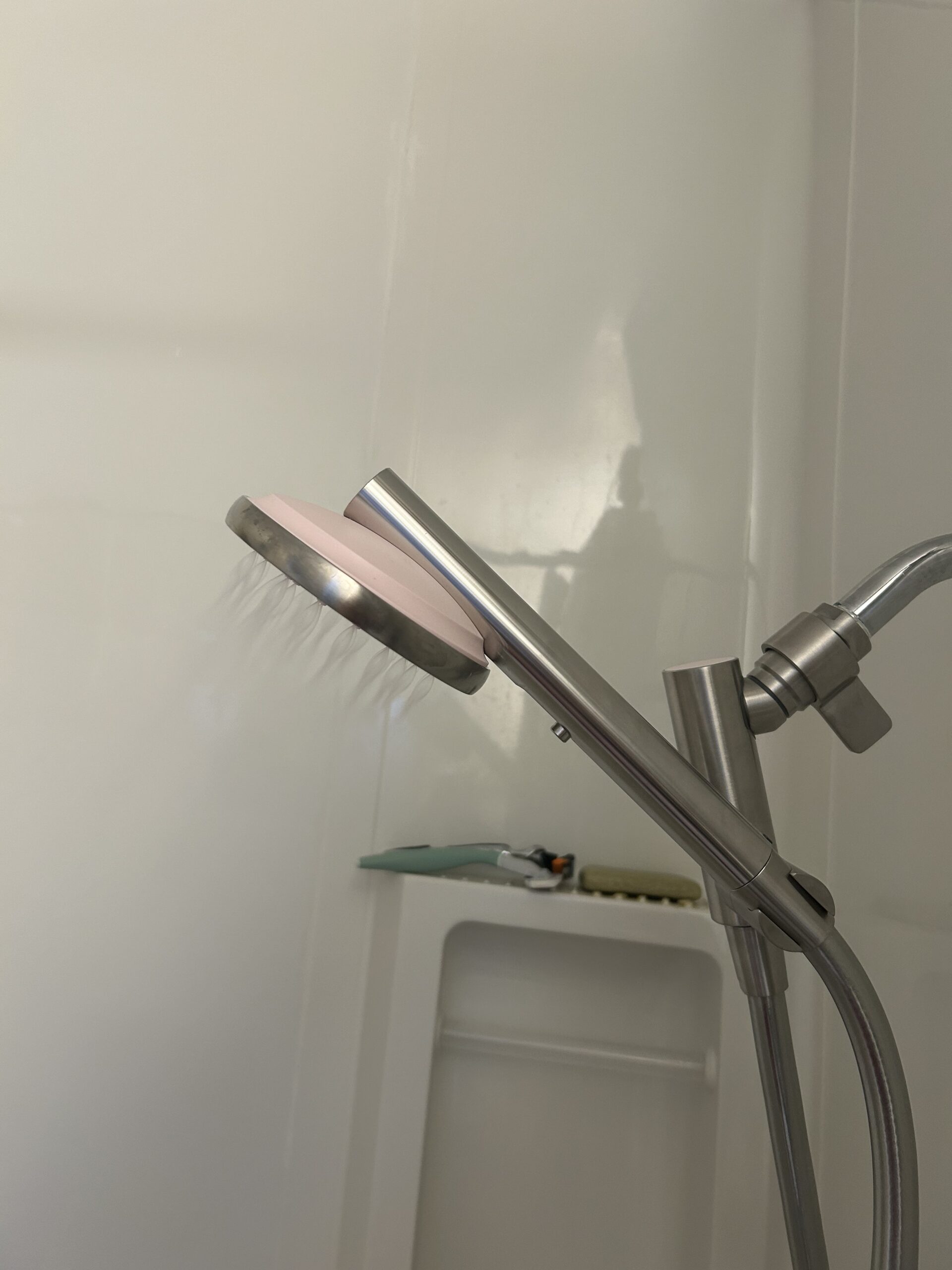 A shower head with a shower head attached to it.