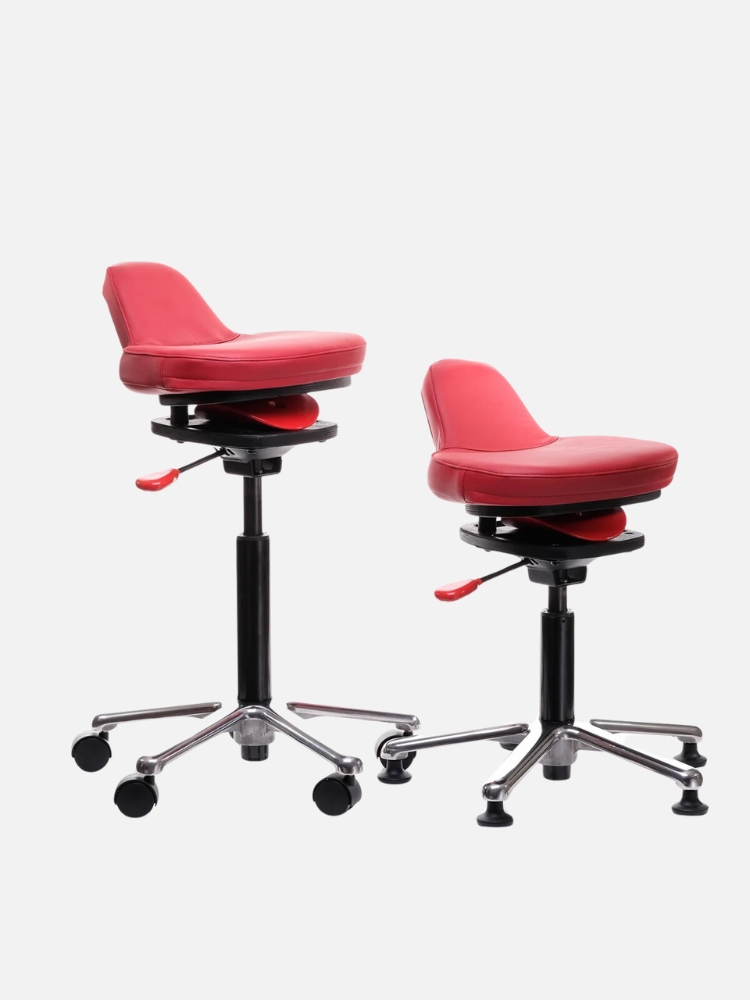 Two red adjustable salon chairs with black bases on wheels, isolated on a white background.