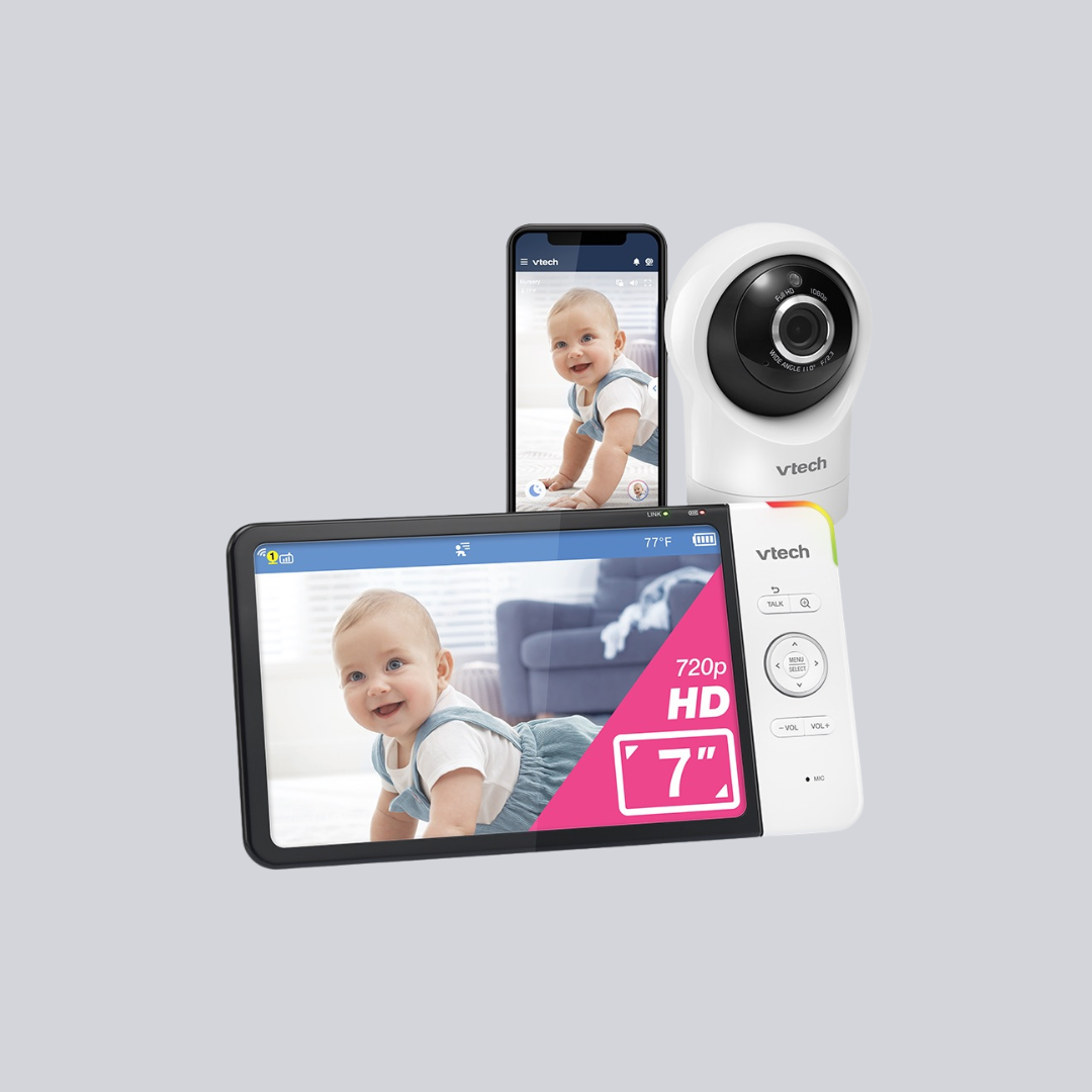 A VTech baby monitor system featuring a 7-inch HD screen, a smartphone display, and a camera unit sits against a plain light gray background—perfect for parents who value wellness gadgets like massage guns.