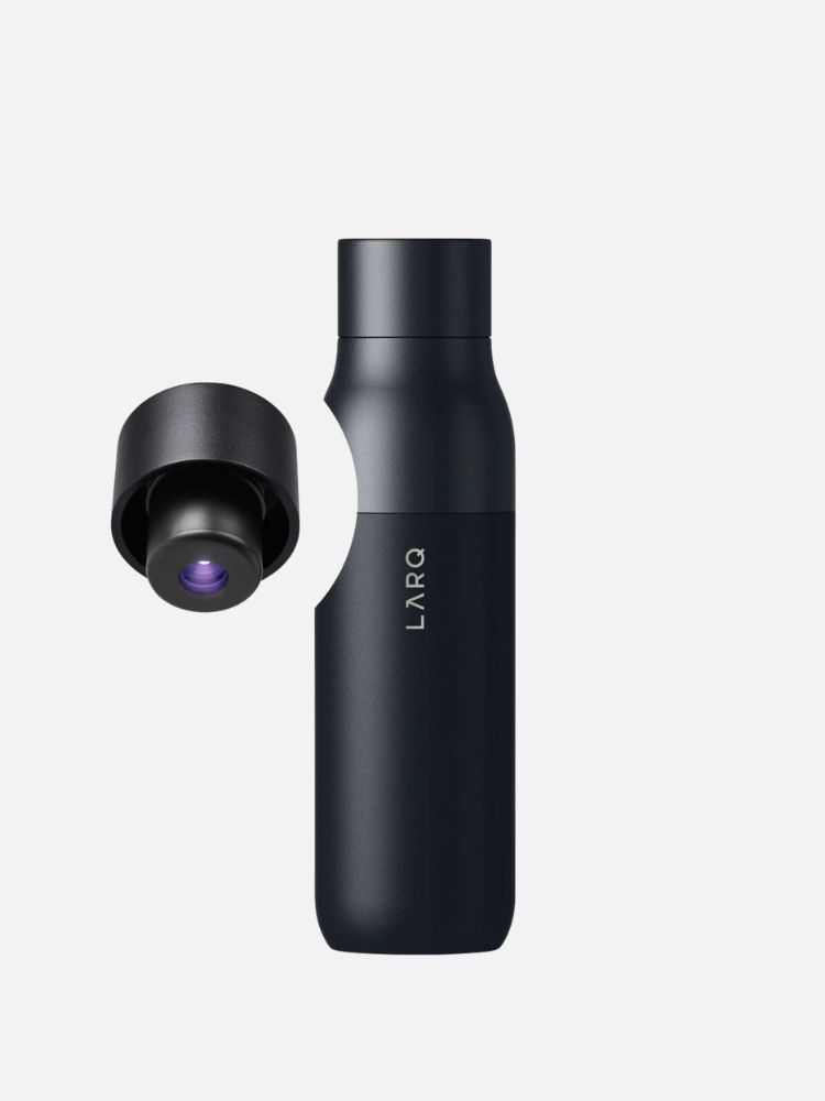 A black LARQ smart waterbottle with its cap removed and placed next to it, showing the inside of the cap.