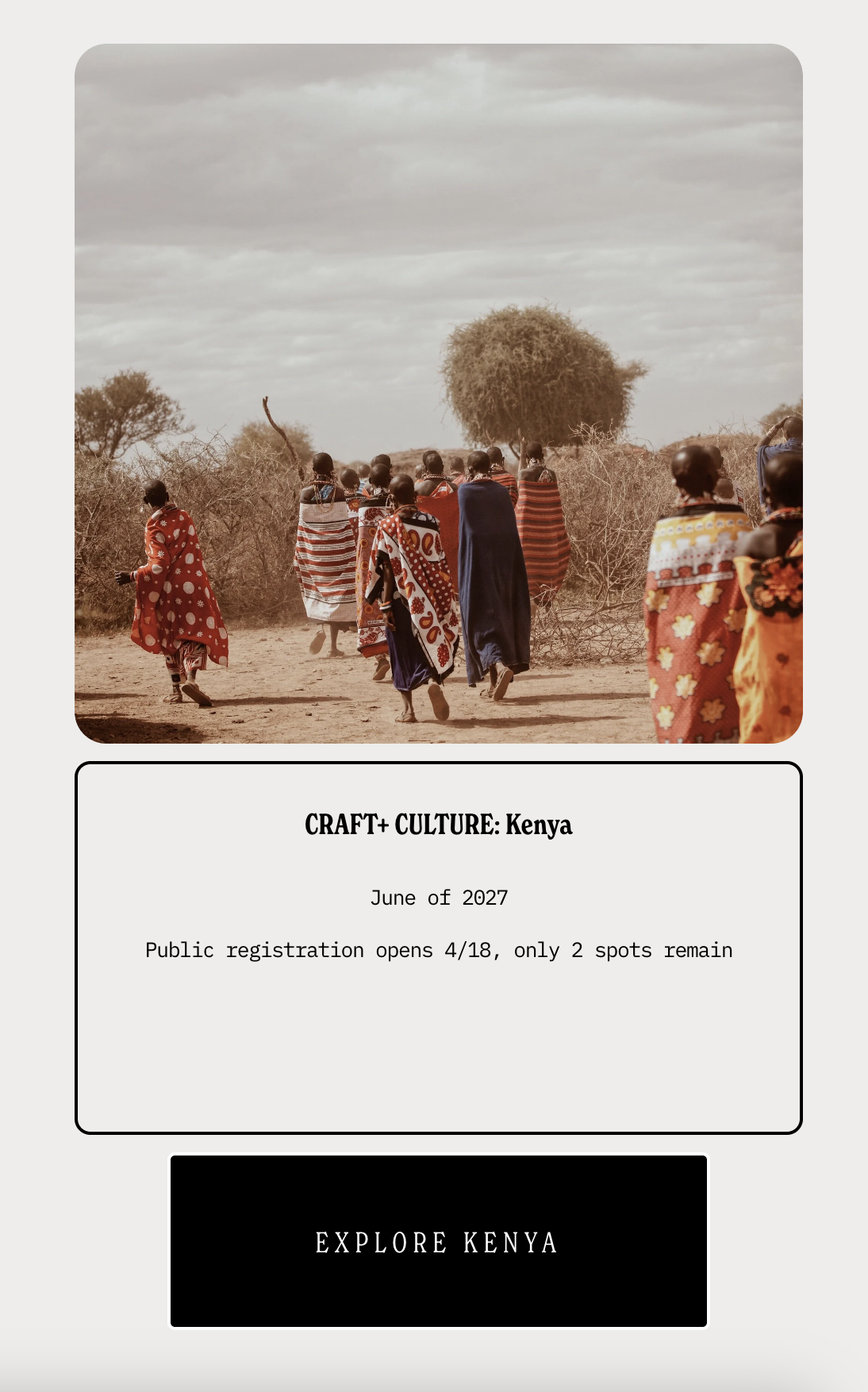 A group of people in colorful traditional clothing walk on a dirt path in a rural Kenyan landscape, with bushes and trees in the background.