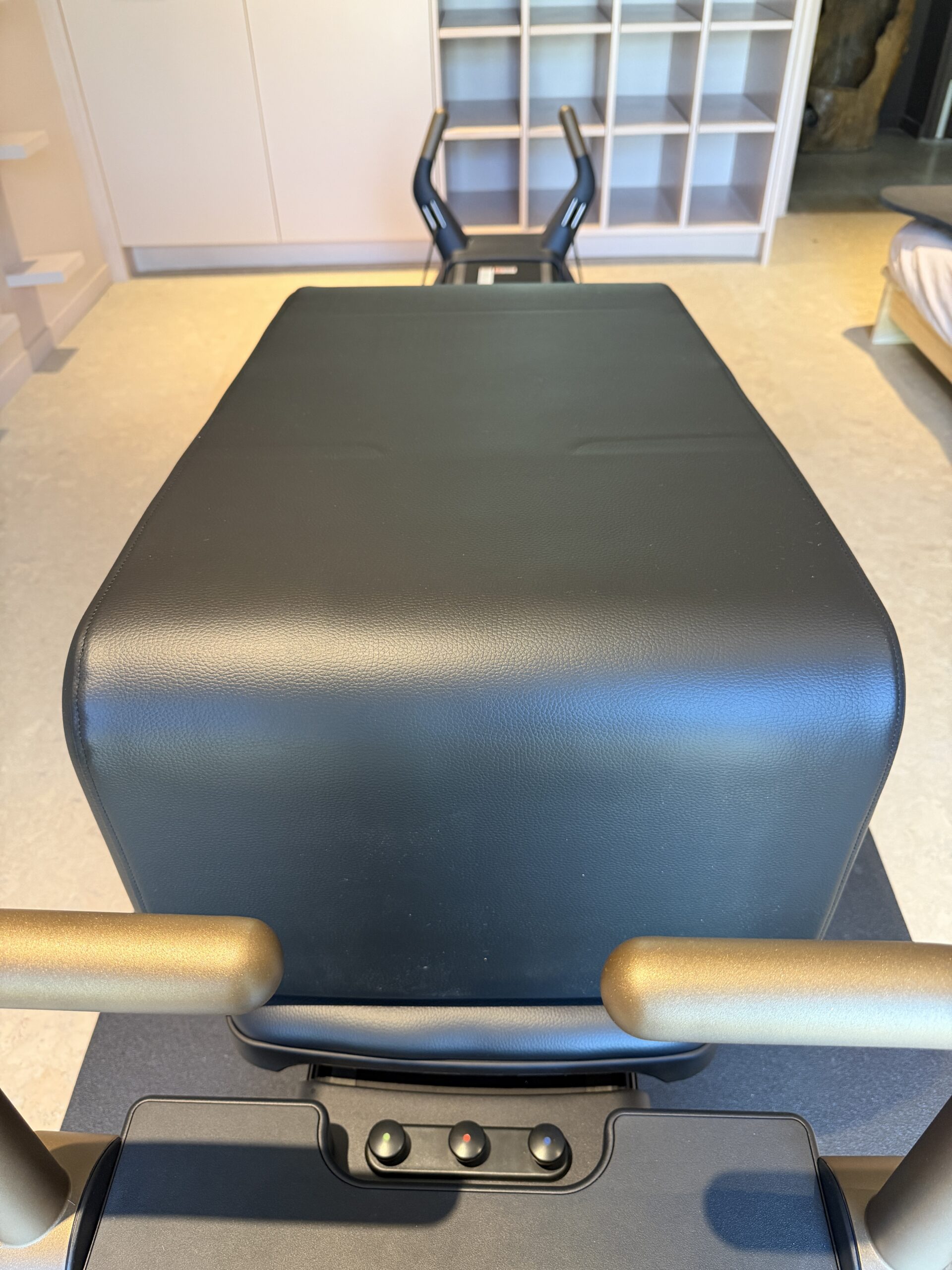 A black, flat-topped Pilates reformer box.